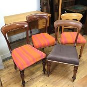 A set of three Victorian mahogany side chairs, two in striped peach and orange upholstery, another