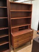 A Mobel Mann teak bookcase over desk fitted two adjustable shelves and an arrangement of drawers and