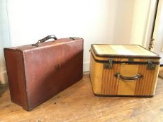 A vintage travelling case with striped canvas exterior, bearing plaque stamped Oshkosh Luggage (32cm