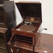 A vintage HMV gramophone, inscribed His Master's Voice, no.4 with hinged lid above a pair of