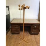 A light oak hallstand with eight hanging pegs in a radiating arrangement (165cm)