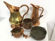 A copper and brass flagon (34cm x 30cm x 19cm) and another copper flagon, two small cauldrons, a