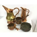 A copper and brass flagon (34cm x 30cm x 19cm) and another copper flagon, two small cauldrons, a