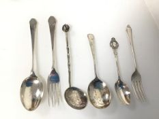 An assortment of silver spoons and forks including a London Coronation of King Edward VIII