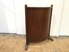 A 1920s/30s oak firescreen with convex panel (72cm x 65cm x 20cm)