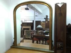 A modern overmantel gilt mirror, with moulded domed frame and acanthus leaf brackets, on moulded