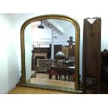 A modern overmantel gilt mirror, with moulded domed frame and acanthus leaf brackets, on moulded