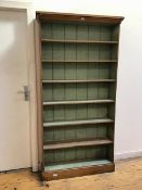 A mid 20thc open bookcase with moulded cornice above seven shelves, the interior painted in duck egg