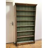 A mid 20thc open bookcase with moulded cornice above seven shelves, the interior painted in duck egg