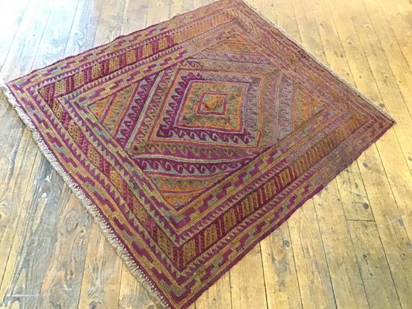 A Mashwani rug, the radiating centre diamond shaped medallion with running dog border enclosed