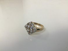 A 9ct gold dress ring with colourless stones in a pierced plaque setting (R) (3.54g)