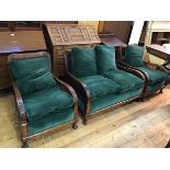 A 1920s bergere suite comprising a two seater sofa and two chairs with cane back and sides, with