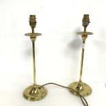 A pair of brass table lamps in the form of candlesticks, marked Quality Brassware, made in England