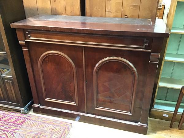 A Victorian mahogany sideboard, lacking superstructure, fitted frieze drawer above a pair of panel