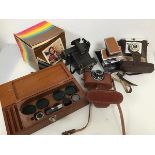 Photography interest: a Polaroid Colour Swinger land camera with original box (17cm x 17cm x