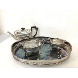 An Epns tea service including teapot (13.5cm x 28cm x 13cm) with matching sugar bowl and milk jug,