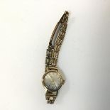 A Tatton Incabloc yellow metal lady's wristwatch on a fancy link rolled gold strap (8cm)