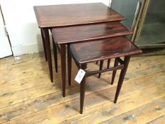 A set of three Danish rosewood graduated tables, c.1965, each rectangular crossbanded top with