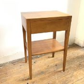 A teak bedside or lamp table with single drawer above a lower tier, on straight tapering legs (
