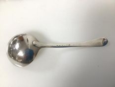 A silver ladle, hallmarks worn (17cm) (55.03g)