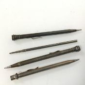 A collection of four Edwardian pencils, one hallmarked (14cm), the other marked sterling (