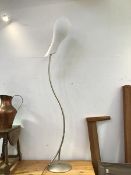 A modern standard lamp with a S scroll stem on circular base, complete with a tulip style opaque