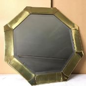 A 1930s brass octagonal wall mirror with panelled border and bevelled glass plate (d.63cm)