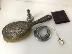 A mixed lot including an Edwardian Sheffield silver backed hairbrush (26cm x 9cm), a taper stick,