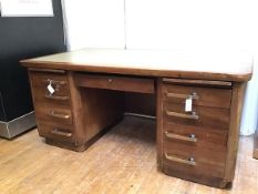 An Art Deco mahogany pedestal desk, stamped Abbess with tooled leather writing surface above two