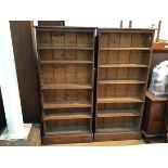 A pair of open bookcases, with adjustable shelves on plinth bases (168cm x 76cm x 25cm)