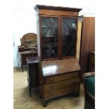 An Edwardian mahogany bureau bookcase, crack to central glass panel of one door, interior with an