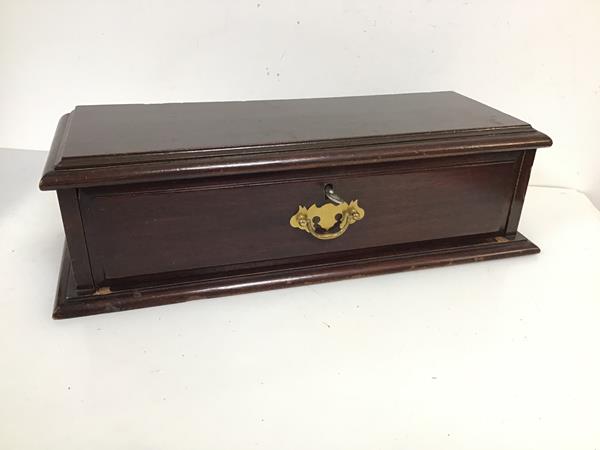 An unusual mahogany stand, with rectangular moulded top above a single frieze drawer, on moulded