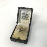 A 9ct gold ring with single pearl in claw setting, in original box (P) (1.86g)