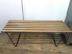 A 1960s slatted bench or low table, with black painted metal angular rod base (a/f) (41cm x 121cm