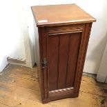 An Edwardian mahogany bedside cabinet, the interior fitted three shelves, lacking one, on bracket