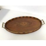 An early 19th c mahogany drinks tray with Prince of Wales feather inlay to centre with raised