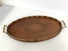 An early 19th c mahogany drinks tray with Prince of Wales feather inlay to centre with raised