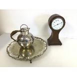 A 1920s/30s mantel clock of hourglass form on bun feet, together with an Epns teapot and footed