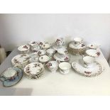 An assortment of Royal Albert Lavender Rose pattern and Roslyn china, including teacups, saucers,