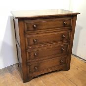 A 1930s/40s oak chest of drawers fitted four long drawers, with panelled sides, on bracket feet (