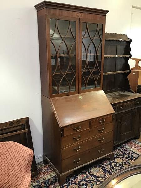 An Edwardian mahogany bureau bookcase, the fitted interior with central inlaid compartment with