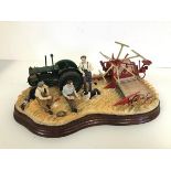 A Border Fine Arts resin scene of Farmers with Harvester, complete with certificate of authenticity,