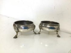 A pair of early George III London silver salt cauldrons, with shell knees and hoof feet, bears