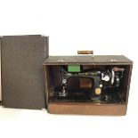 A 1930s/40s Singer sewing machine with original travelling case (case: 33cm x 23cm x 48cm)