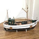 A wooden model of a Fishing Trawler, complete with stand (43cm x 54cm x 14cm)