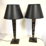 A pair of modern tapered column tolle table lamps, with black body and painted butterfly