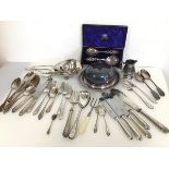 An assortment of Epns including a lidded serving dish, dinner forks and knives, spoons, fish