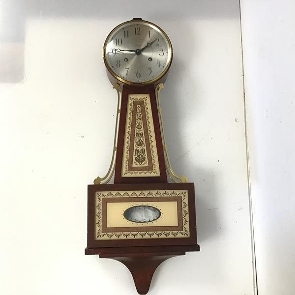 A modern Seth Thomas wall clock with painted glass panels, missing finial (67cm x 27cm x 10cm)