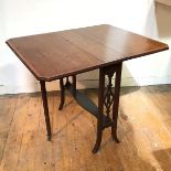 An Edwardian mahogany Sutherland table with crossbanded top, the sides with pierced splats above a