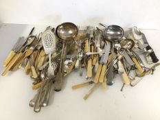 A large quantity of Epns cutlery including bone handled knives and forks, sugar nips, knife rests